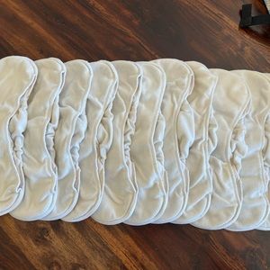 Grovia bamboo soaker inserts with snaps and diaper covers.